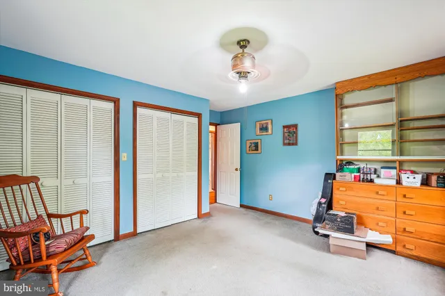 a room with a bed and window