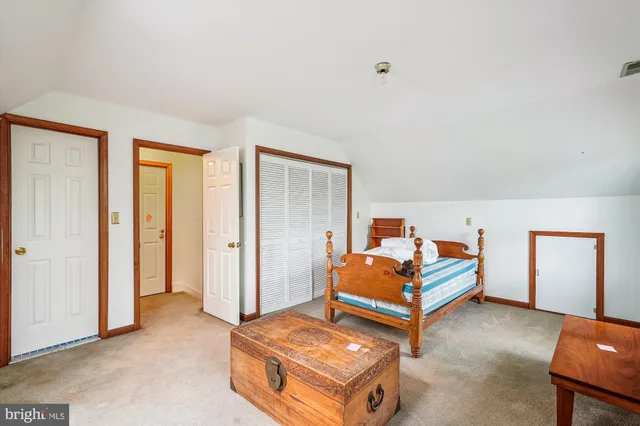 a utility room with fridge dryer and washer