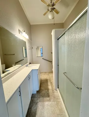 a bathroom with a sink a mirror and a shower