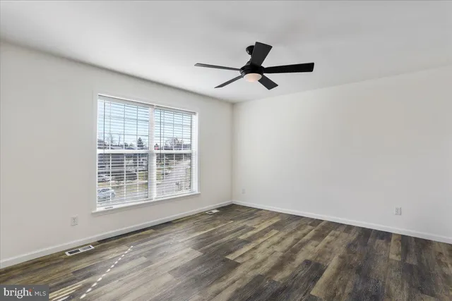 a view of a livingroom with a dishwasher and a window