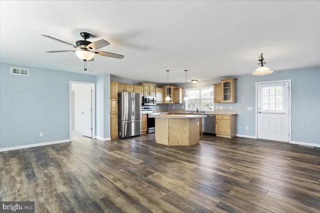 a view of a kitchen with a sink and cabinet
