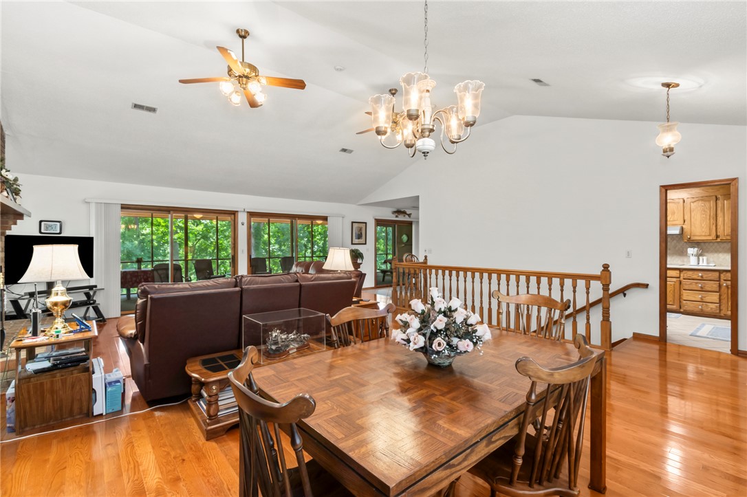 202 Plantation Point Anderson, SC 29625 - Photo 8 of 48 An open concept living and dining area boasts rich hardwood floors and abundant natural light.