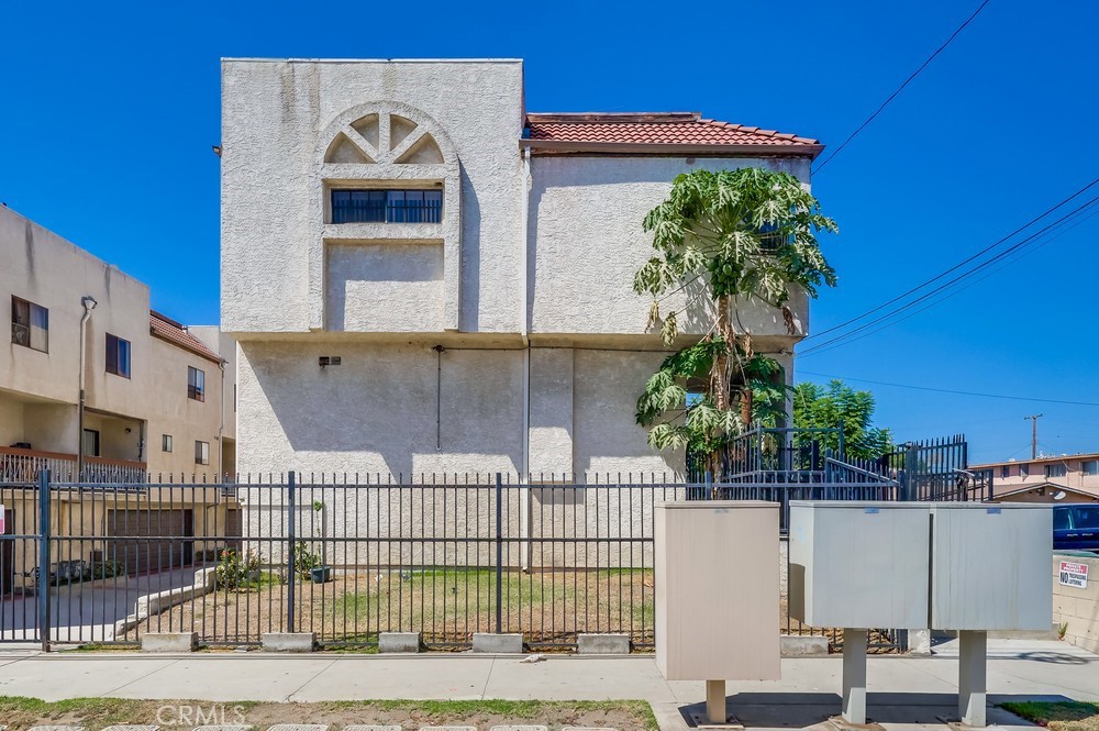 a view of a house with a iron gate