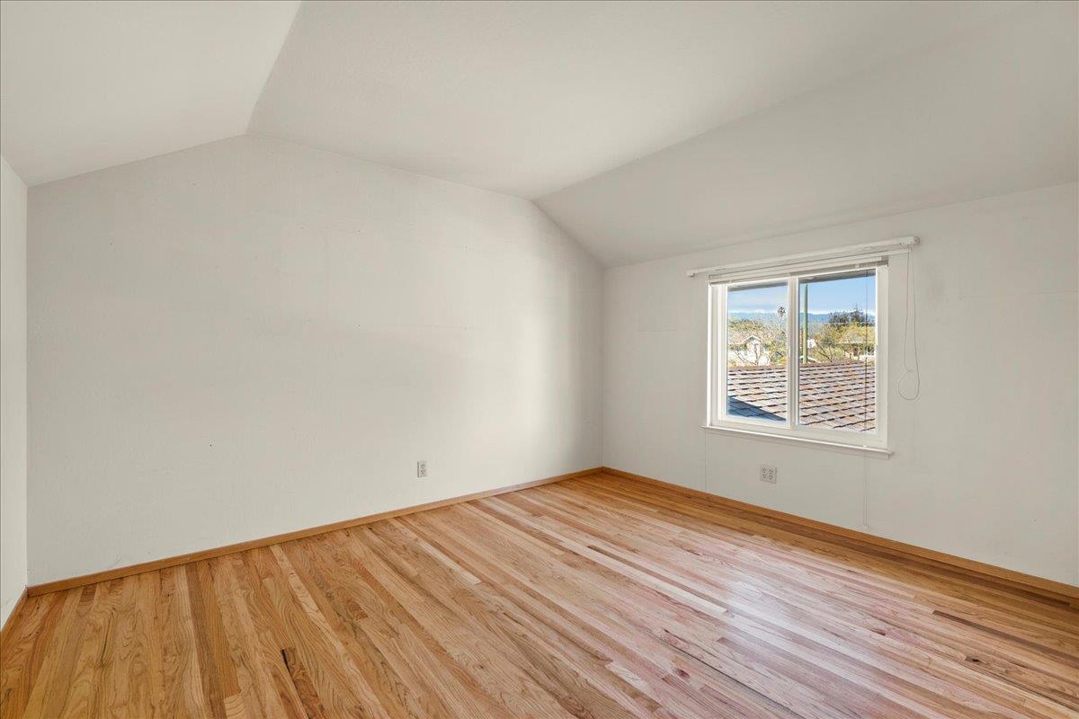 2330 Montezuma Drive Campbell, CA 95008 - Photo 10 of 19 a view of an empty room with wooden floor and a window