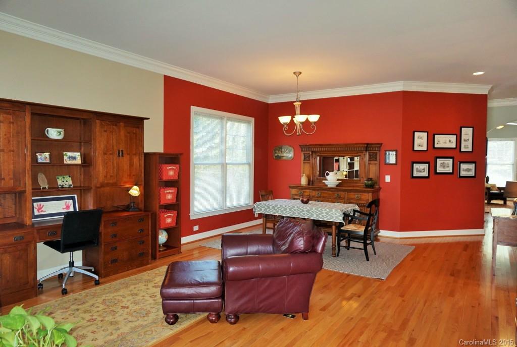 149 Mills Lane Fort Mill, SC 29708 - Photo 2 of 24 a living room with furniture a dining table and chairs with wooden floor