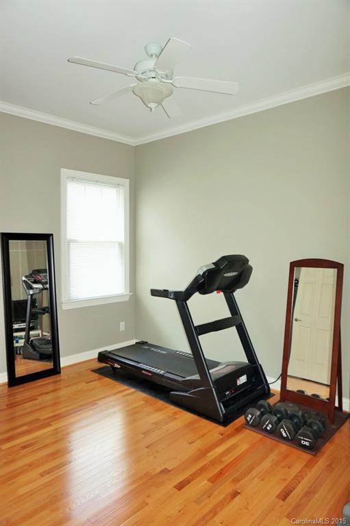 149 Mills Lane Fort Mill, SC 29708 - Photo 19 of 24 a room with gym equipment and wooden floor
