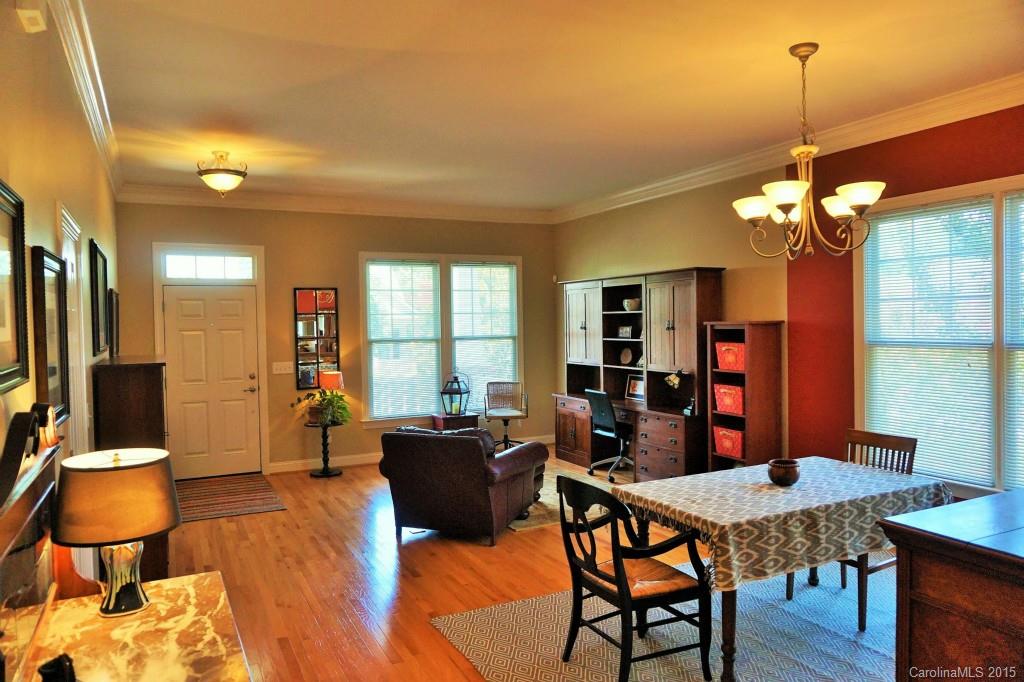 149 Mills Lane Fort Mill, SC 29708 - Photo 3 of 24 a view of a dining room with furniture and wooden floor
