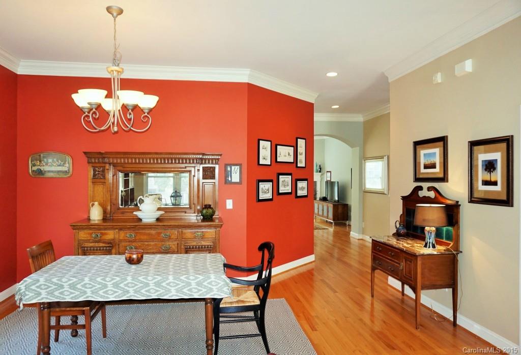 149 Mills Lane Fort Mill, SC 29708 - Photo 4 of 24 a kitchen with a dining table chairs and chandelier
