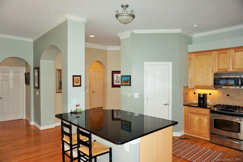 149 Mills Lane Fort Mill, SC 29708 - Photo 7 of 24 a kitchen with stainless steel appliances granite countertop a sink a stove and refrigerator