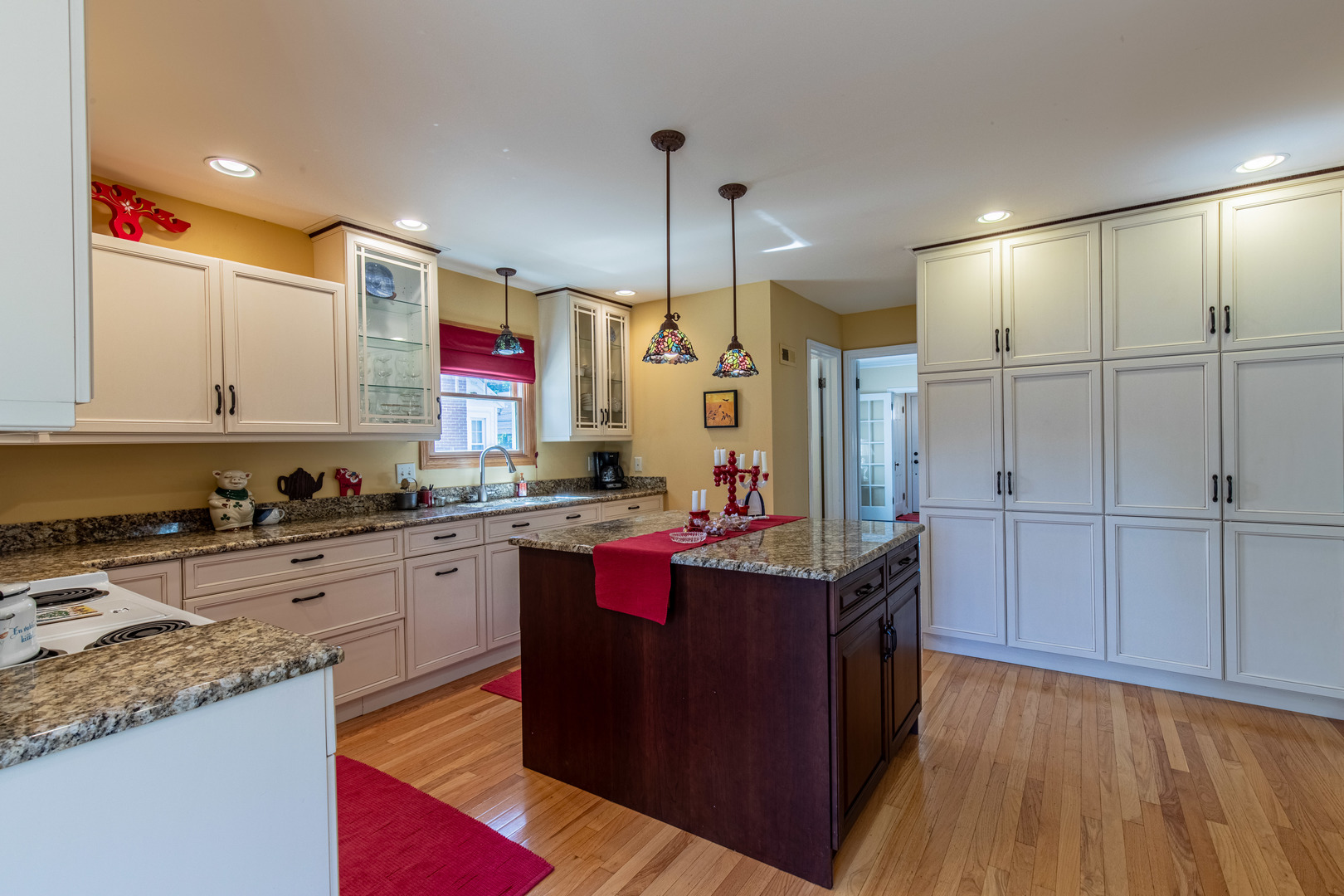 428 East Thompson Street Princeton, IL 61356 - Photo 17 of 32 a kitchen with kitchen island granite countertop a sink counter space and cabinets