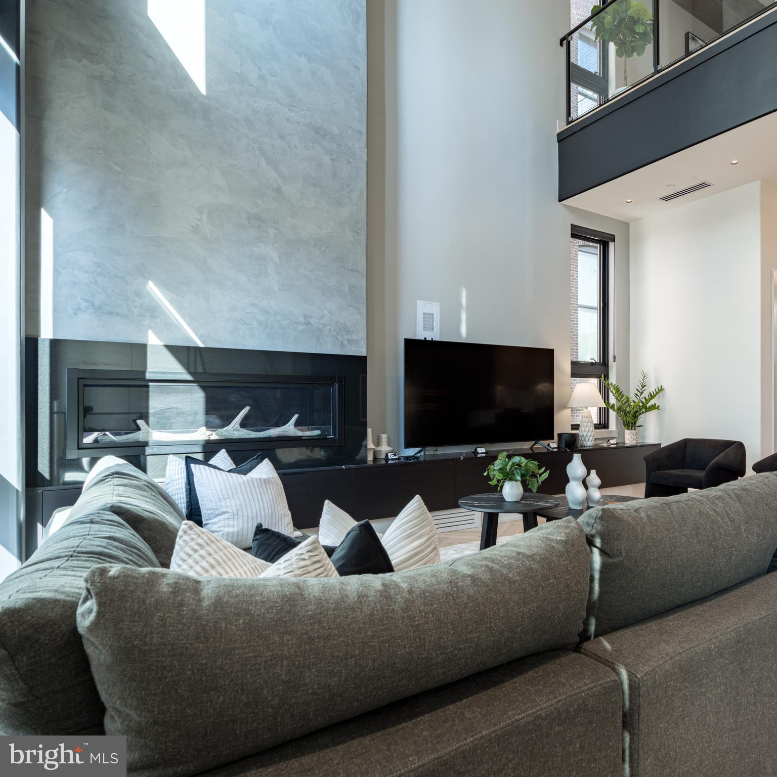 111 South 24th Street Philadelphia, PA 19103 - Photo 15 of 57 a living room with furniture and a flat screen tv