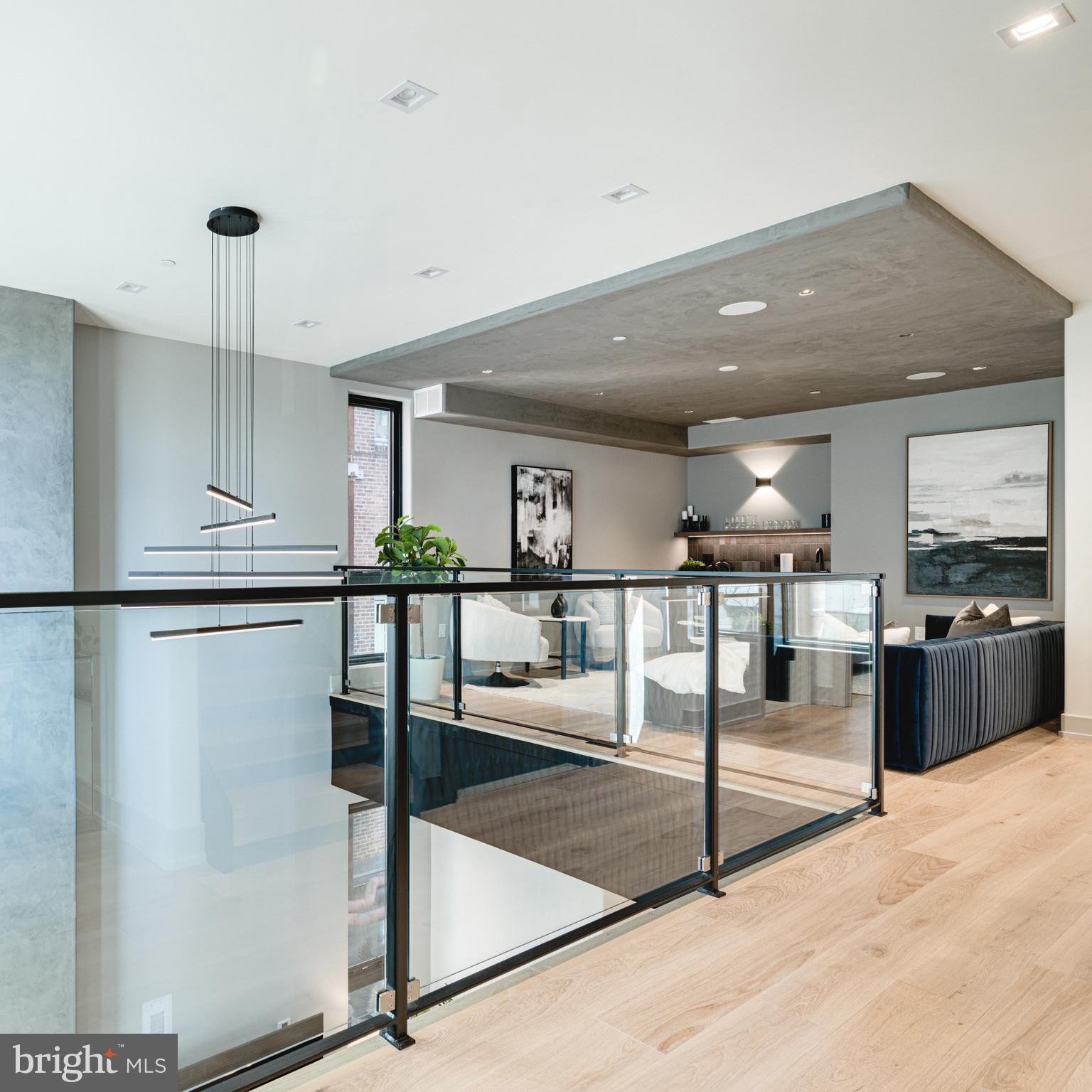 111 South 24th Street Philadelphia, PA 19103 - Photo 16 of 57 a kitchen with stainless steel appliances kitchen island granite countertop a refrigerator a stove and a sink