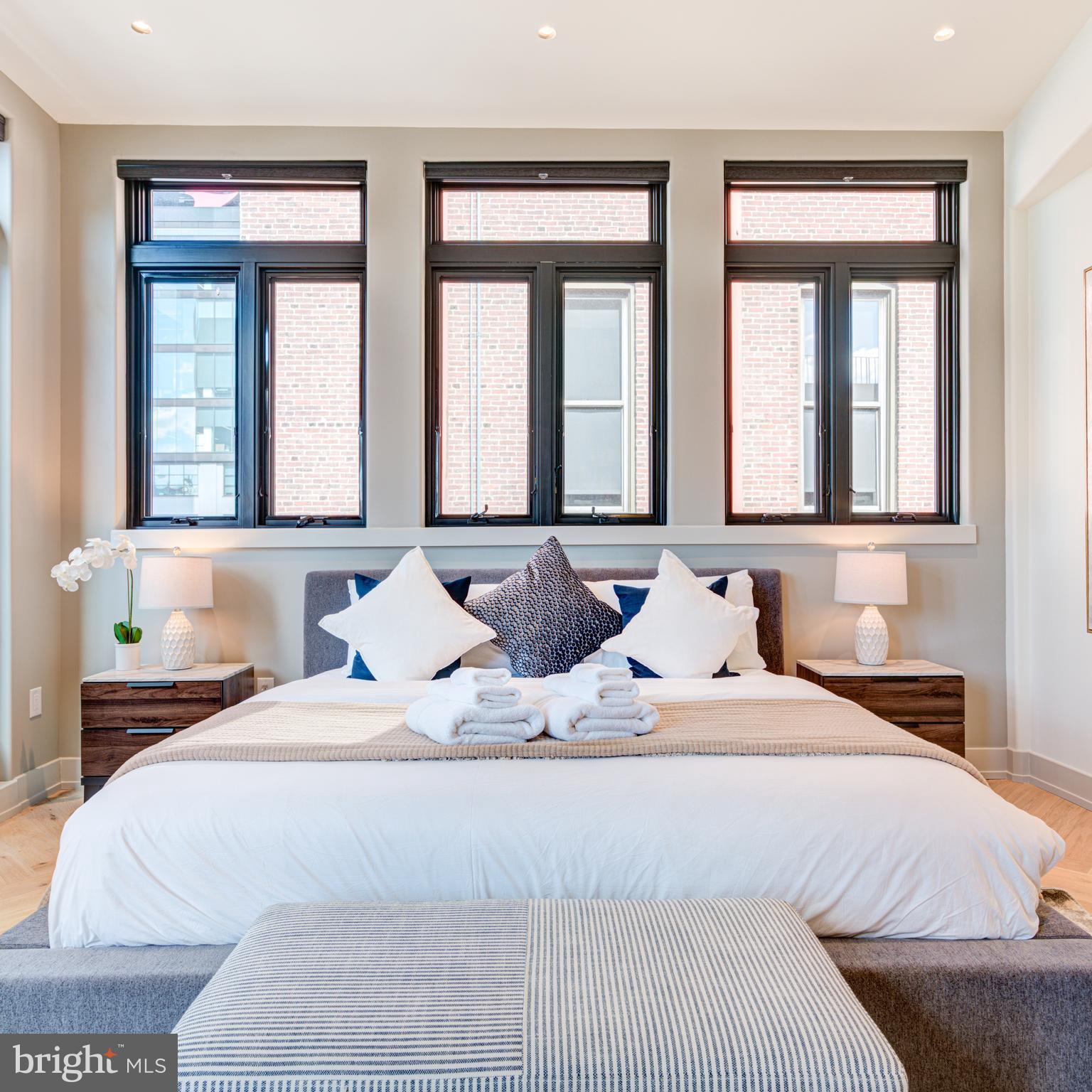 111 South 24th Street Philadelphia, PA 19103 - Photo 22 of 57 a bedroom with two beds and a large window