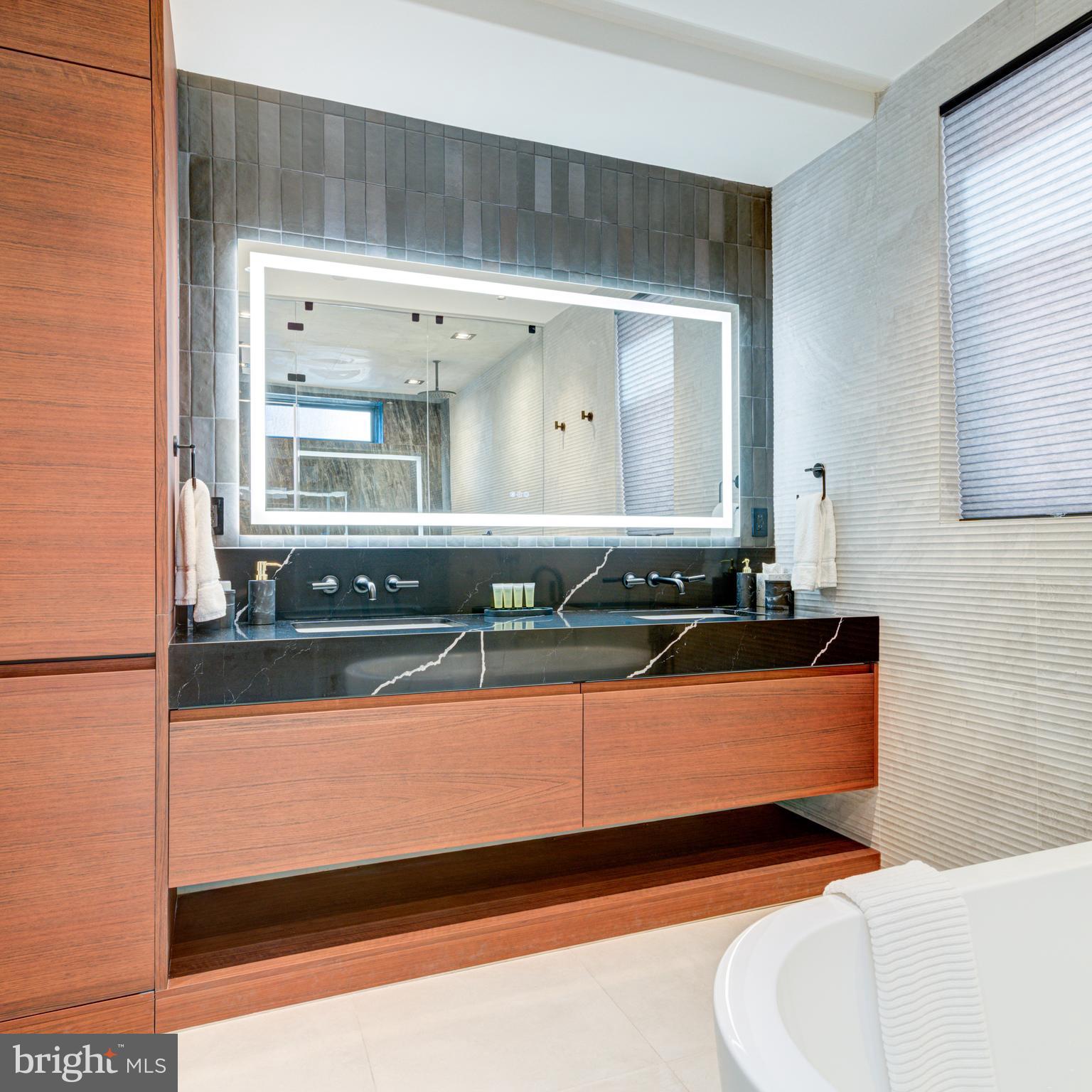 111 South 24th Street Philadelphia, PA 19103 - Photo 26 of 57 a bathroom with a sink and a mirror