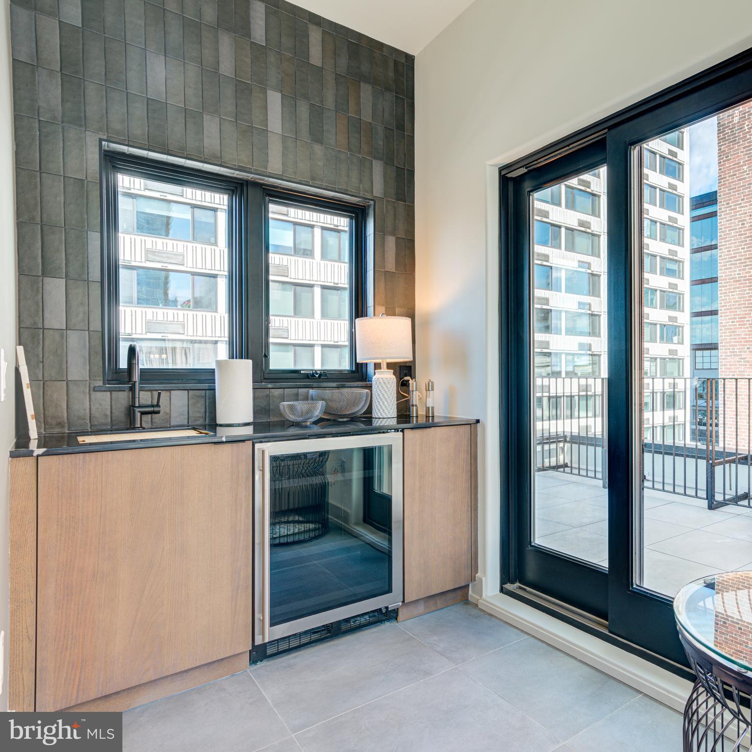 111 South 24th Street Philadelphia, PA 19103 - Photo 36 of 57 a kitchen with granite countertop white cabinets and stainless steel appliances