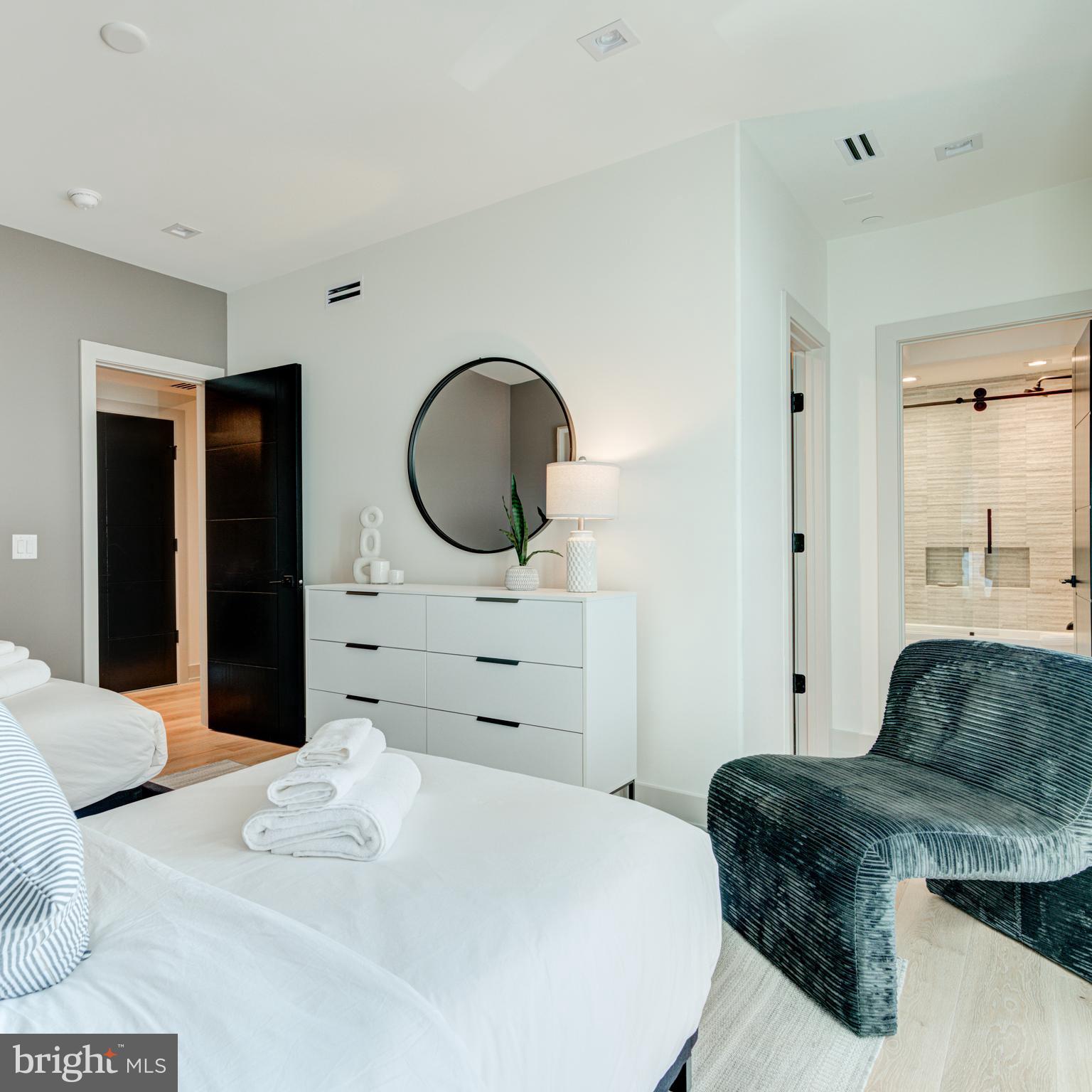 111 South 24th Street Philadelphia, PA 19103 - Photo 47 of 57 a bedroom with a bed and a dresser