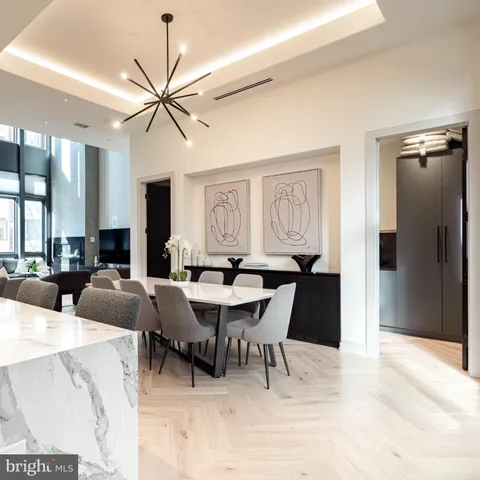 a view of a dining room with furniture and window