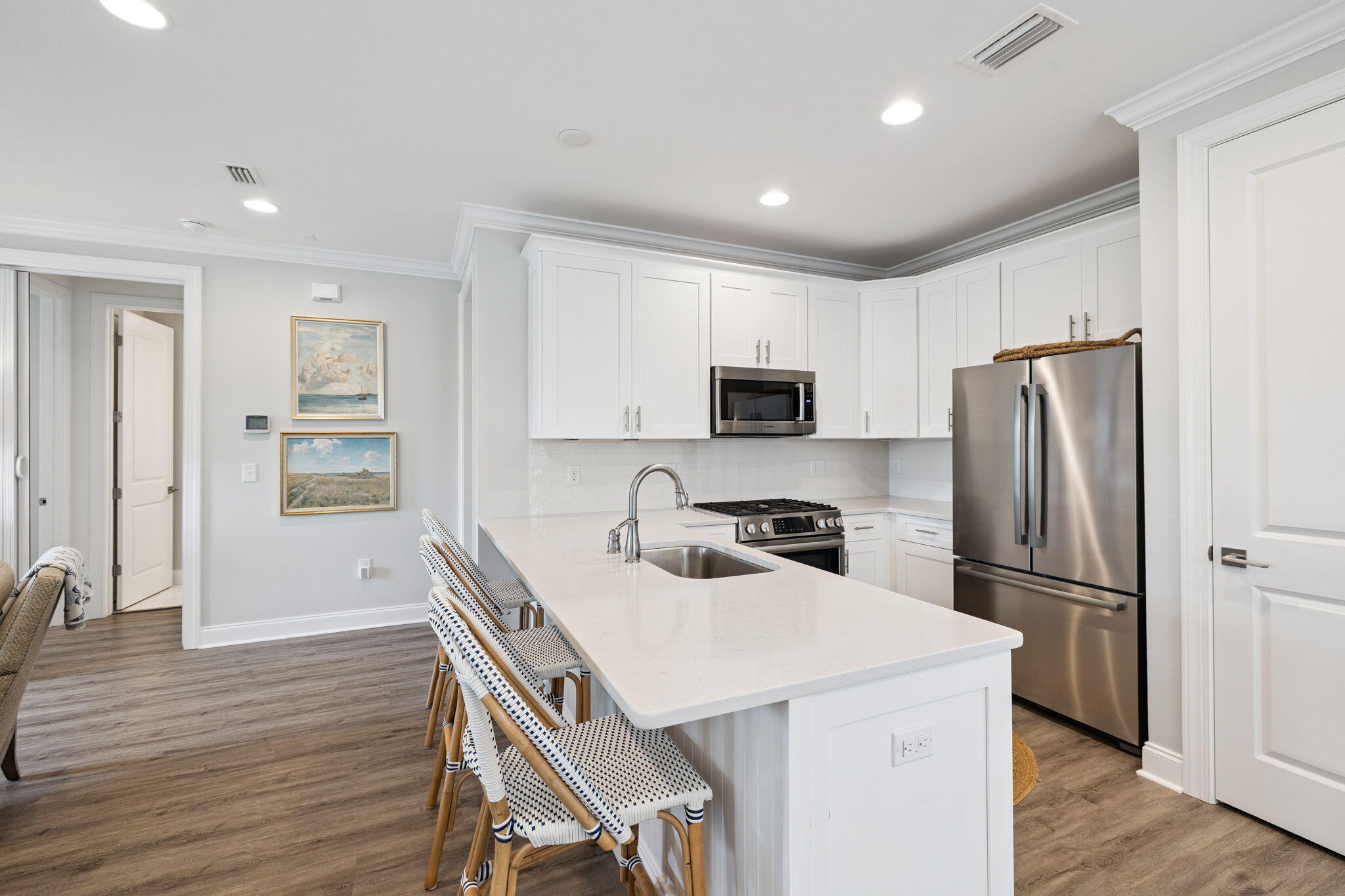 89 Cambium Ct Inlet Beach Inlet Beach, FL 32461 - Photo 10 of 32 a kitchen with a refrigerator a stove a sink cabinets and wooden floor