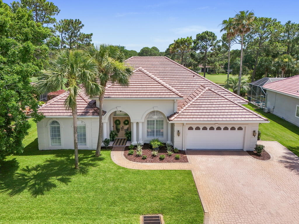 527 Indigo Loop Miramar Beach, FL 32550 - Photo 1 of 40 a front view of a house with a garden and plants
