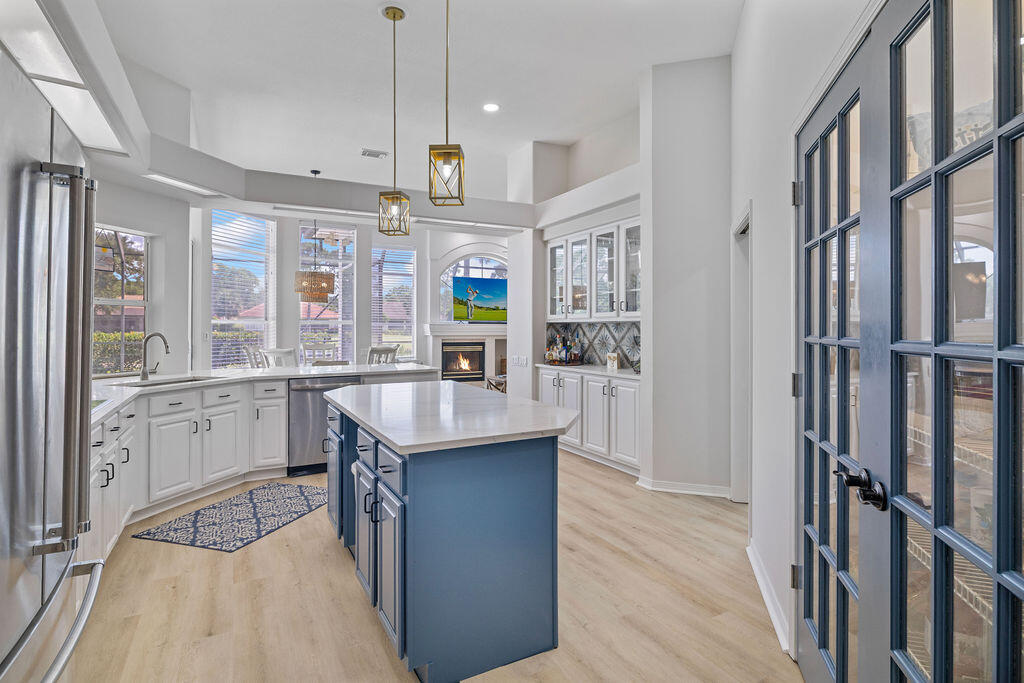 527 Indigo Loop Miramar Beach, FL 32550 - Photo 11 of 40 a kitchen with counter top space and wooden floor