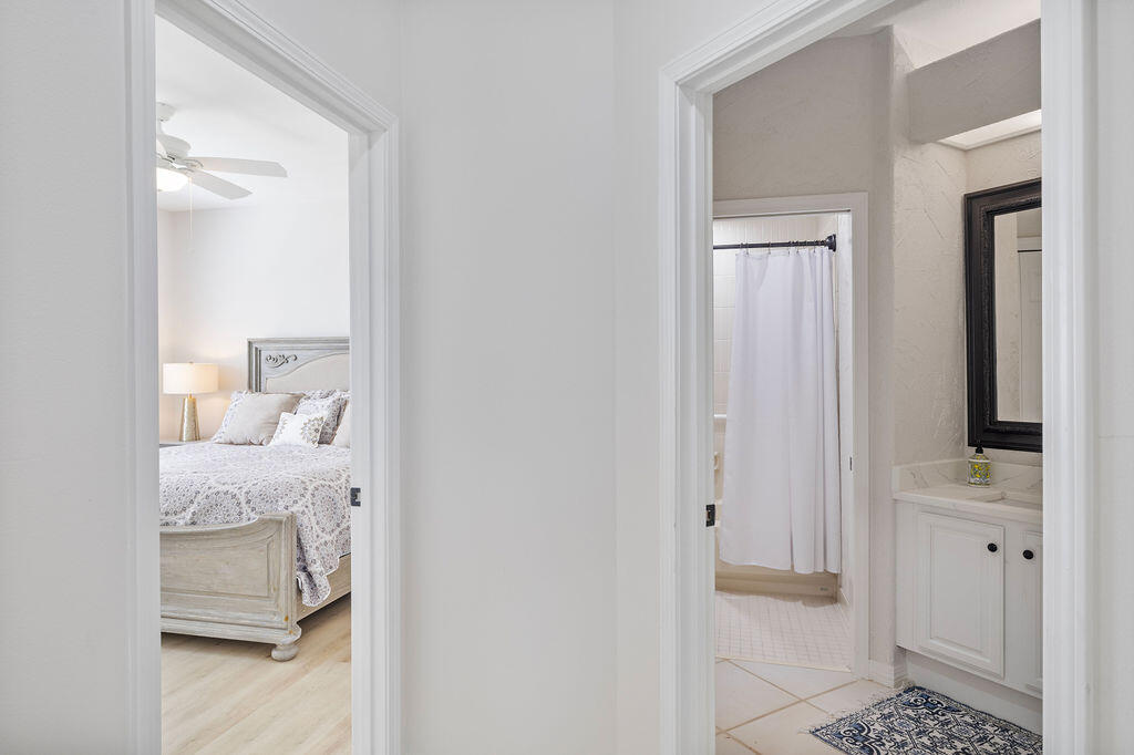 527 Indigo Loop Miramar Beach, FL 32550 - Photo 19 of 40 a en suite bathroom with a sink and a mirror