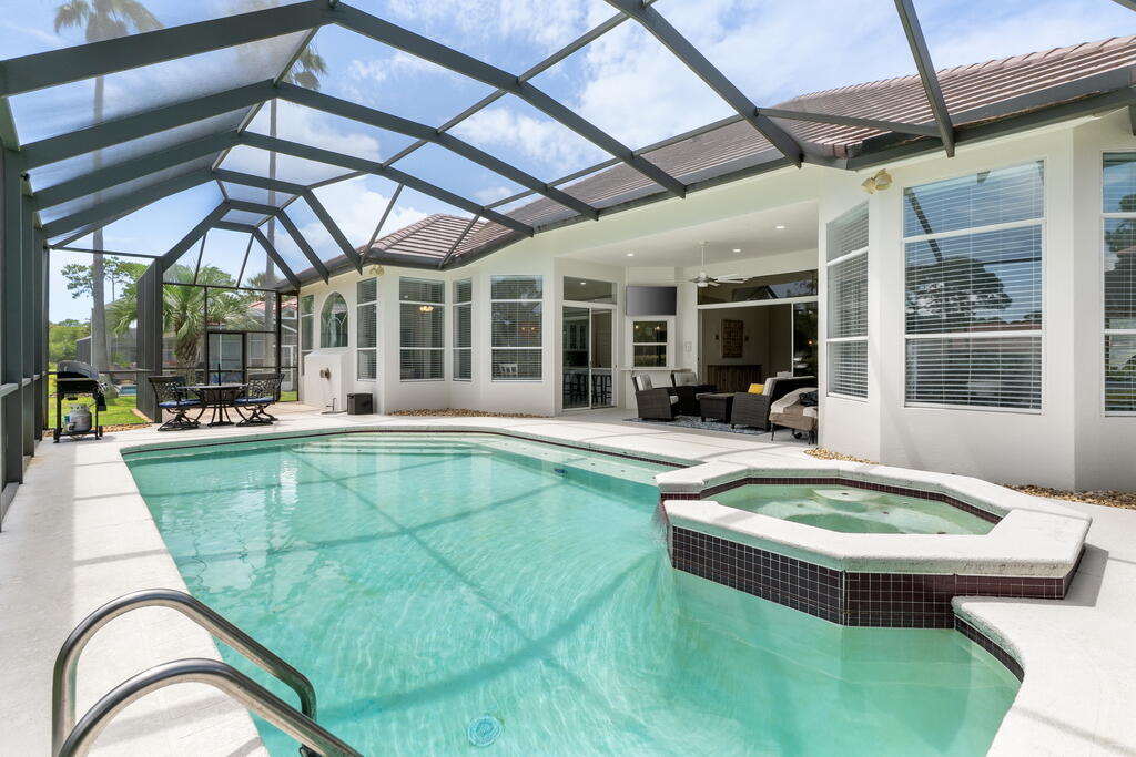 527 Indigo Loop Miramar Beach, FL 32550 - Photo 2 of 40 a swimming pool with outdoor seating