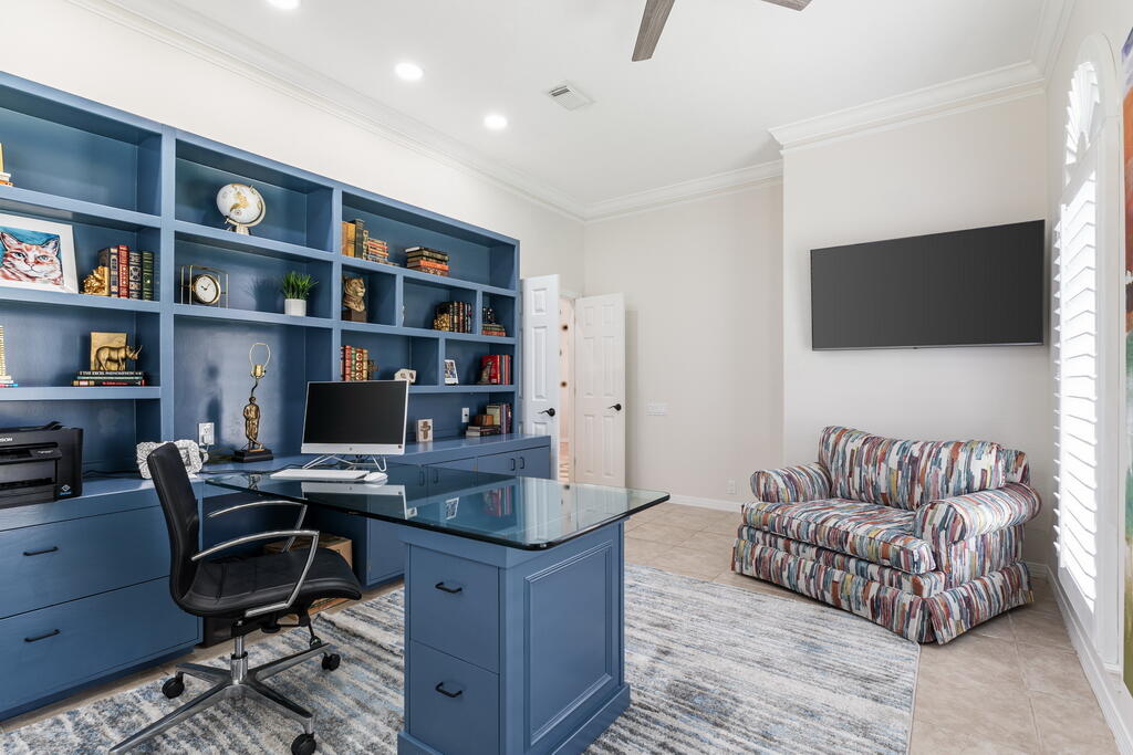 527 Indigo Loop Miramar Beach, FL 32550 - Photo 24 of 40 a workspace with furniture and bookshelf