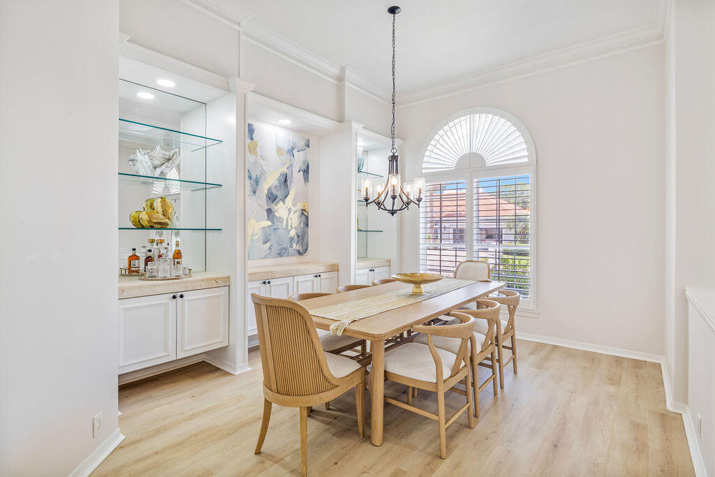 527 Indigo Loop Miramar Beach, FL 32550 - Photo 30 of 40 a view of a dining room with furniture window and wooden floor