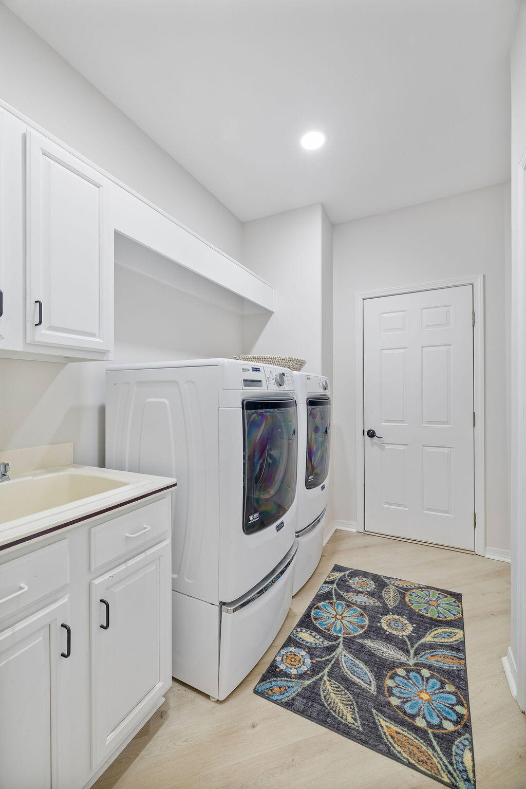 527 Indigo Loop Miramar Beach, FL 32550 - Photo 32 of 40 a utility room with cabinets washer and dryer