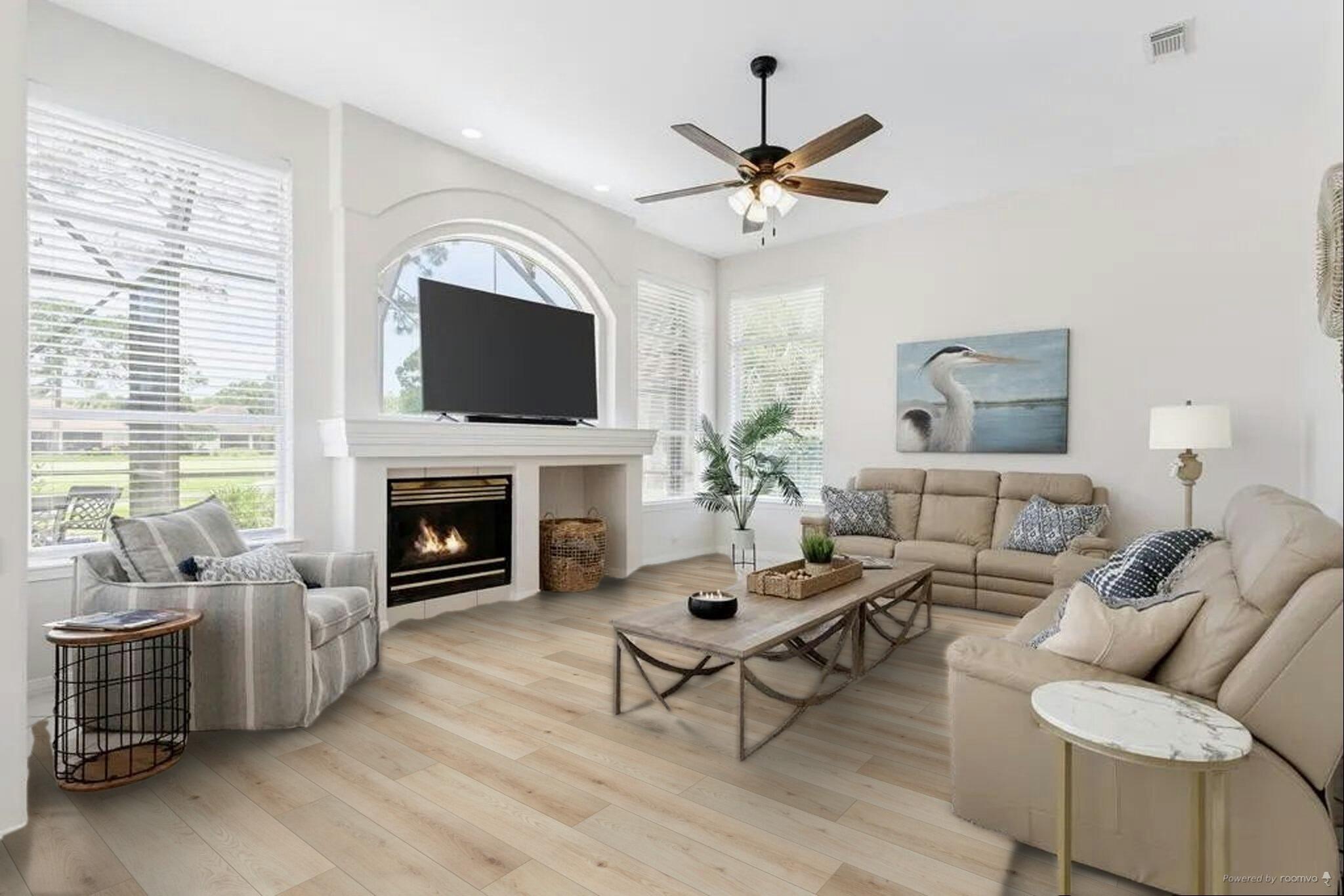 527 Indigo Loop Miramar Beach, FL 32550 - Photo 5 of 40 a living room with furniture a flat screen tv and a fireplace