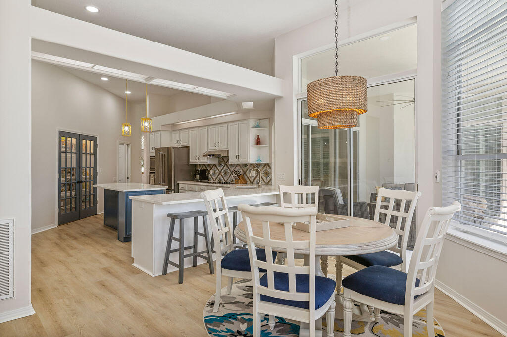 527 Indigo Loop Miramar Beach, FL 32550 - Photo 10 of 40 a view of a dining room with furniture and a chandelier