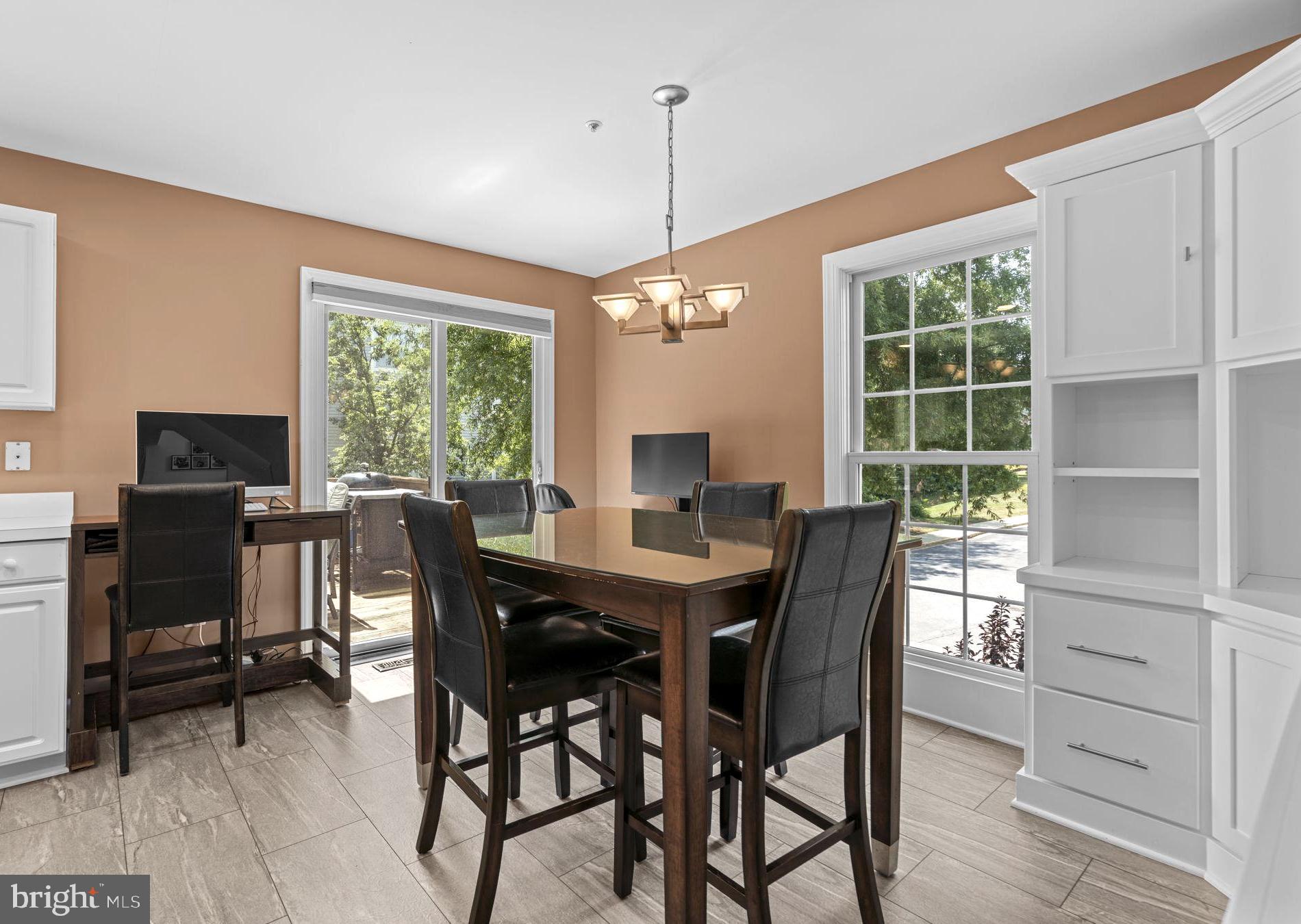 2023 Compton Court Annapolis, MD 21401 - Photo 12 of 35 Dining area with custom built ins and new slider