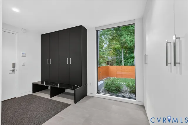 a view of a livingroom with furniture and front door