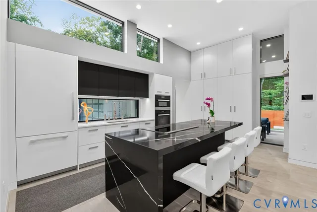 a kitchen with a table and chairs in it