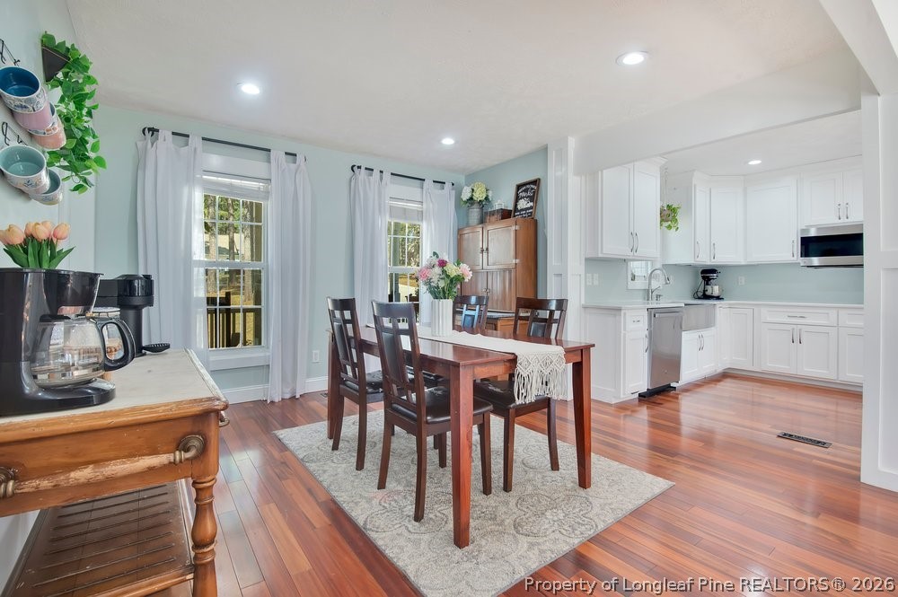 419 Senter Lane Bunnlevel, NC 28323 - Photo 14 of 49 a view of kitchen with cabinets table and chairs