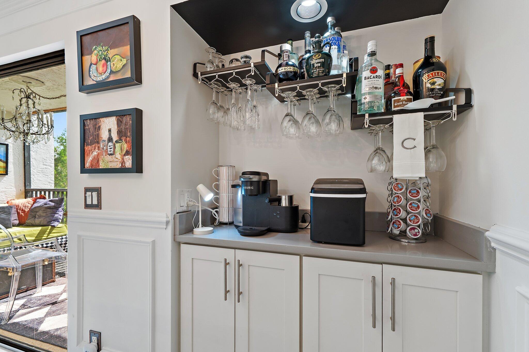 1605 Highway 1, Unit F202 Jupiter, FL 33477 - Photo 16 of 33 a kitchen with a refrigerator and cabinets