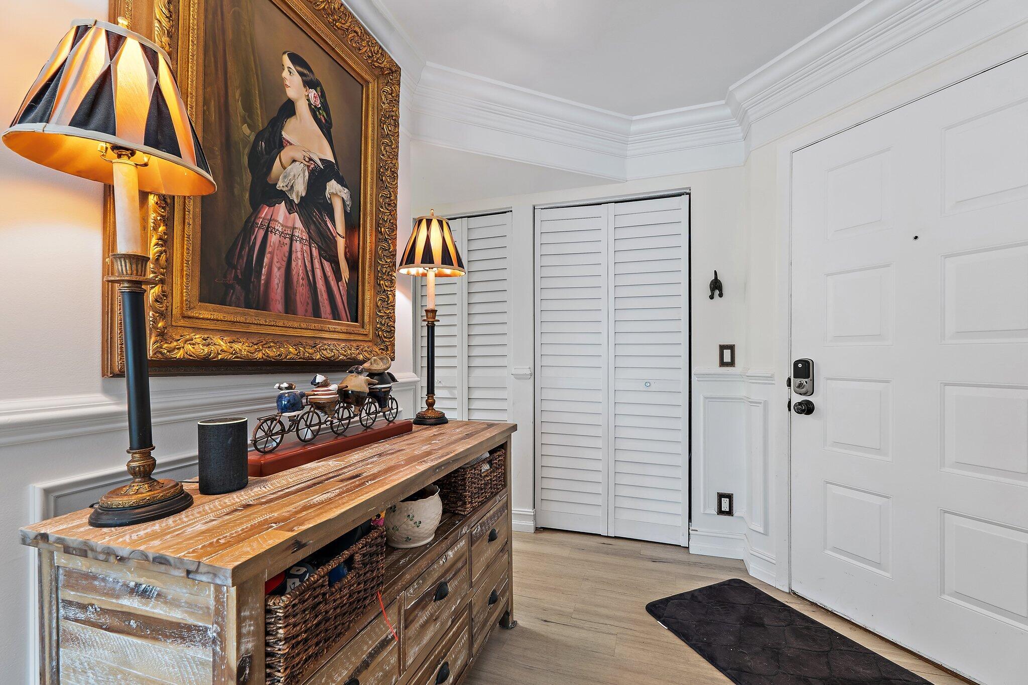 1605 Highway 1, Unit F202 Jupiter, FL 33477 - Photo 3 of 33 a view of an entryway with wooden floor
