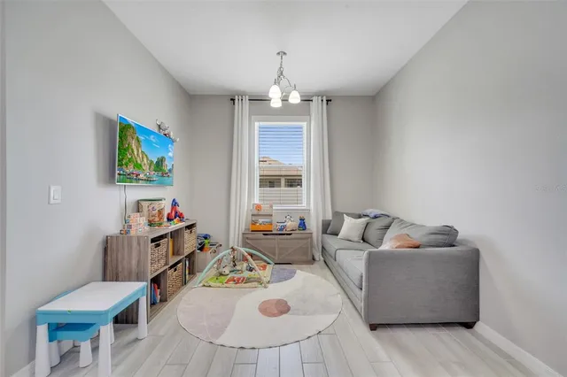 a living room with furniture and a window