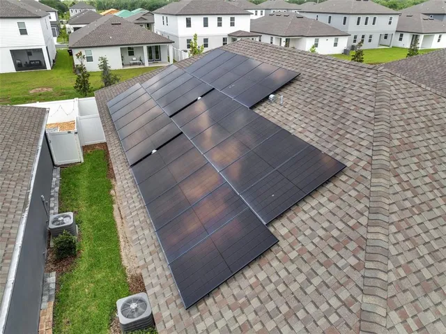a front view of house with a garden