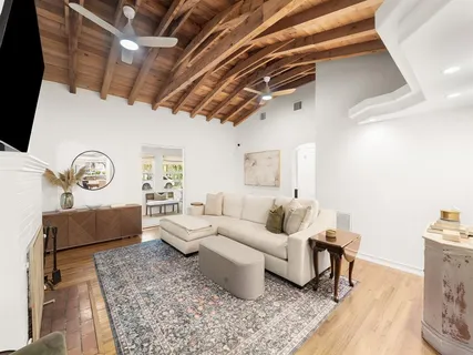 a living room with furniture and a rug