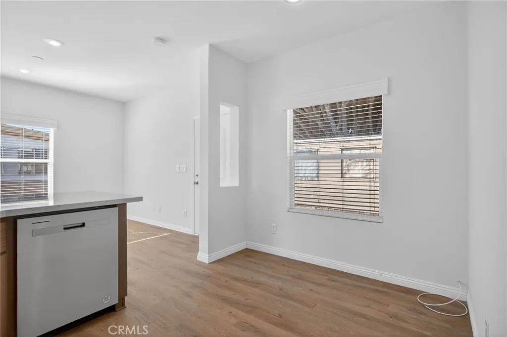 520 Pine Goleta Ca, Unit 55 Goleta, CA 93117 - Photo 16 of 25 a view of an empty room with wooden floor and a window