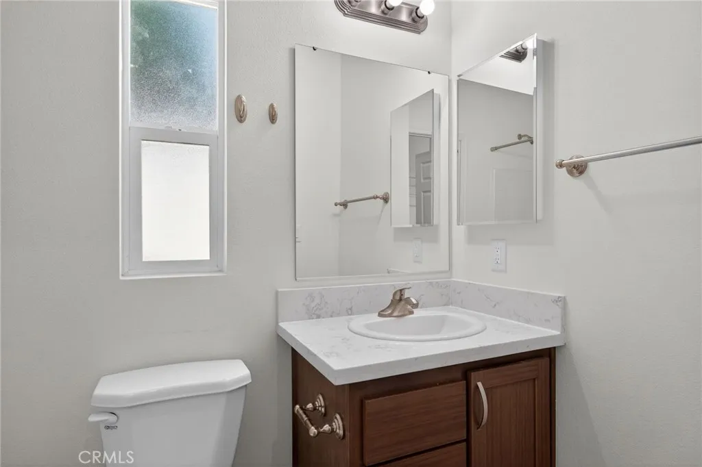 520 Pine Goleta Ca, Unit 55 Goleta, CA 93117 - Photo 23 of 25 a bathroom with a sink toilet and vanity