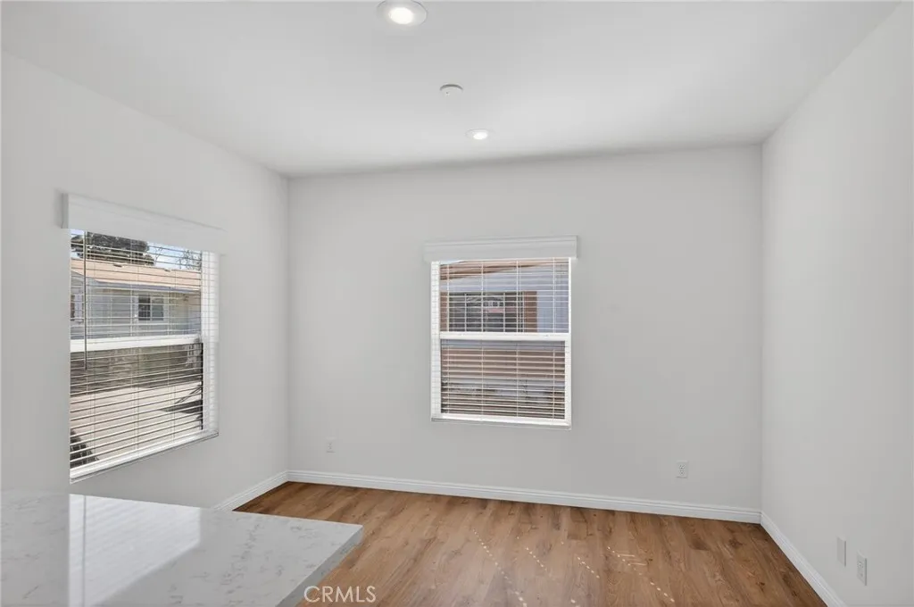 520 Pine Goleta Ca, Unit 55 Goleta, CA 93117 - Photo 7 of 25 a view of an empty room with wooden floor and a window