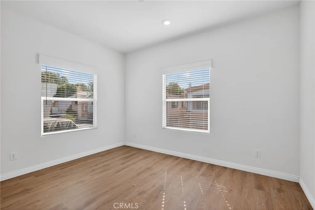 520 Pine Goleta Ca, Unit 55 Goleta, CA 93117 - Photo 8 of 25 a view of an empty room with wooden floor and a window