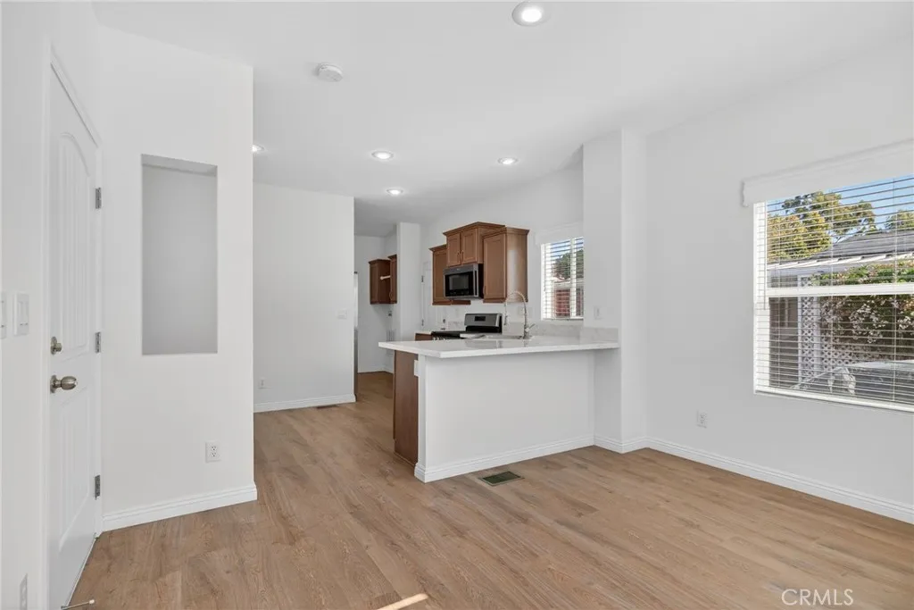 520 Pine Goleta Ca, Unit 55 Goleta, CA 93117 - Photo 9 of 25 a view of a kitchen with wooden floor and a sink