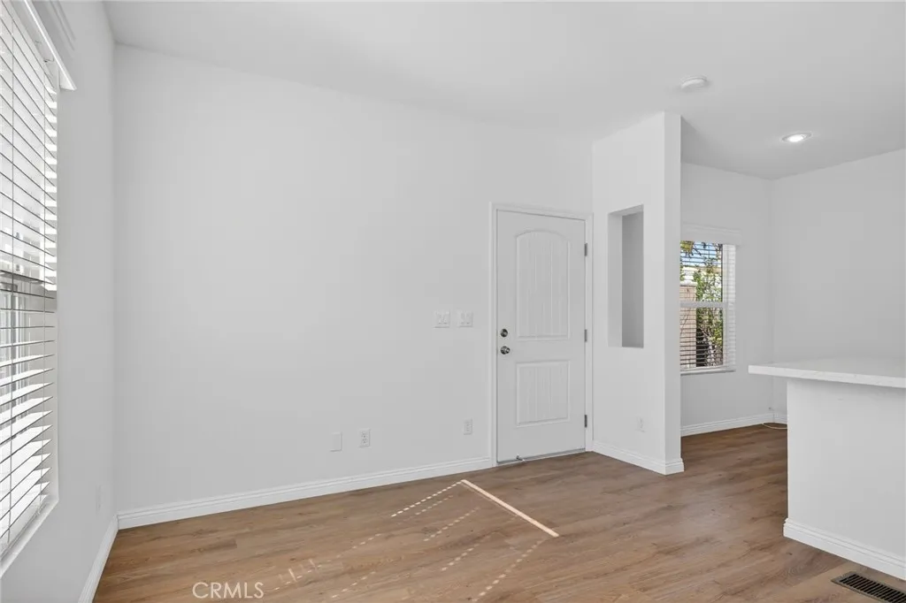 520 Pine Goleta Ca, Unit 55 Goleta, CA 93117 - Photo 10 of 25 a view of an empty room with wooden floor and a window