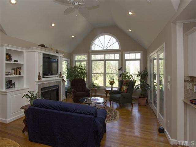 910 Lake Boone Trail Raleigh, NC 27607 - Photo 16 of 25 Family room with wall of windows to view the lovely backyard and entry to screened porch. Den/Family/Great Room