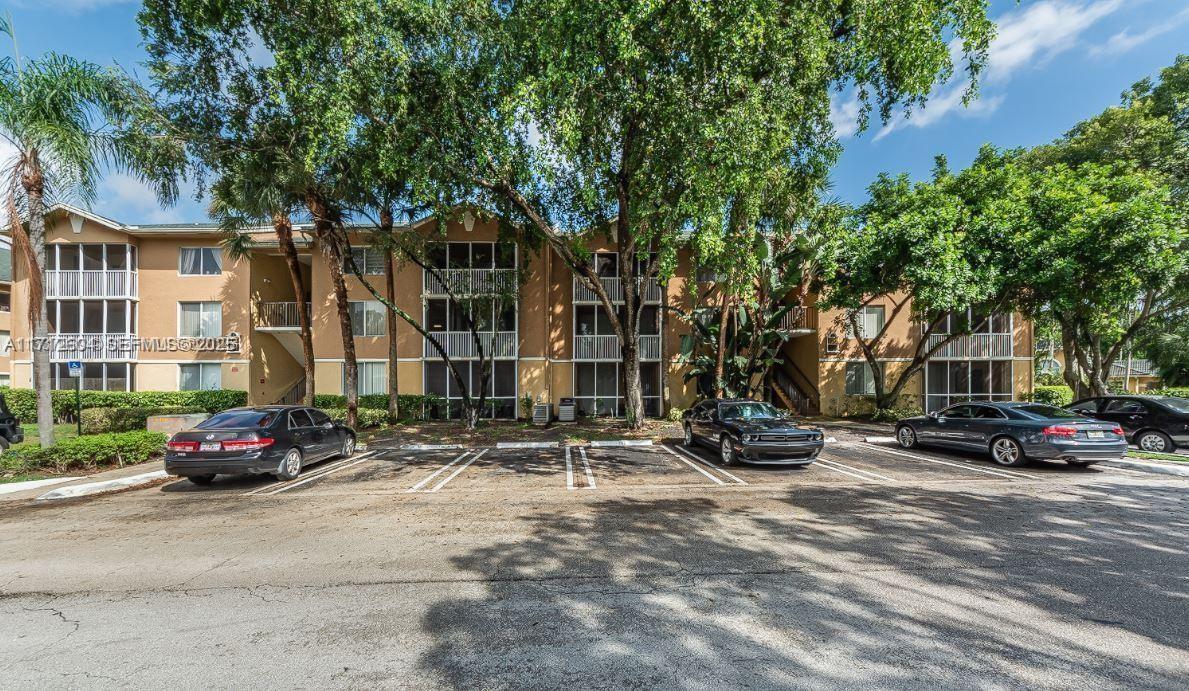 Palm Aire Pompano Beach, FL 33069 - Photo 3 of 11 a car parked in front of a building