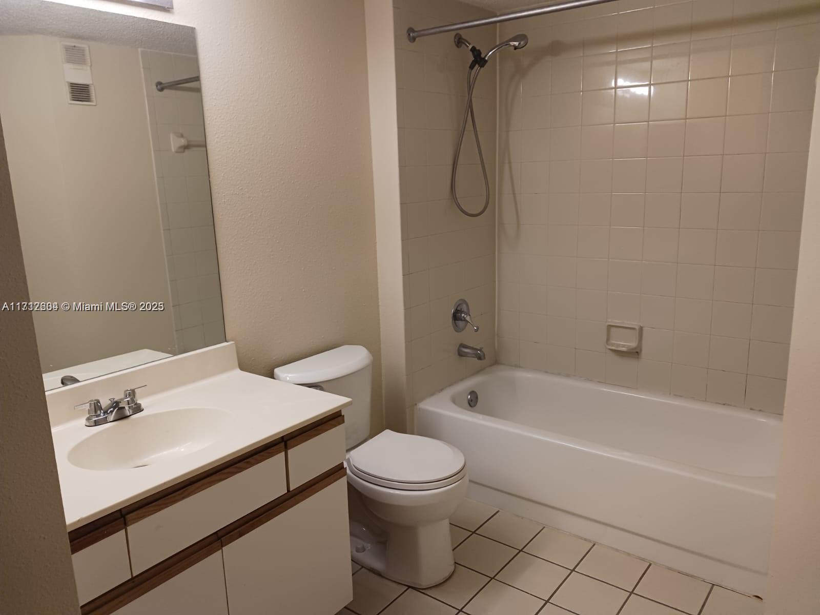 Palm Aire Pompano Beach, FL 33069 - Photo 10 of 11 a bathroom with a sink a toilet and a bathtub