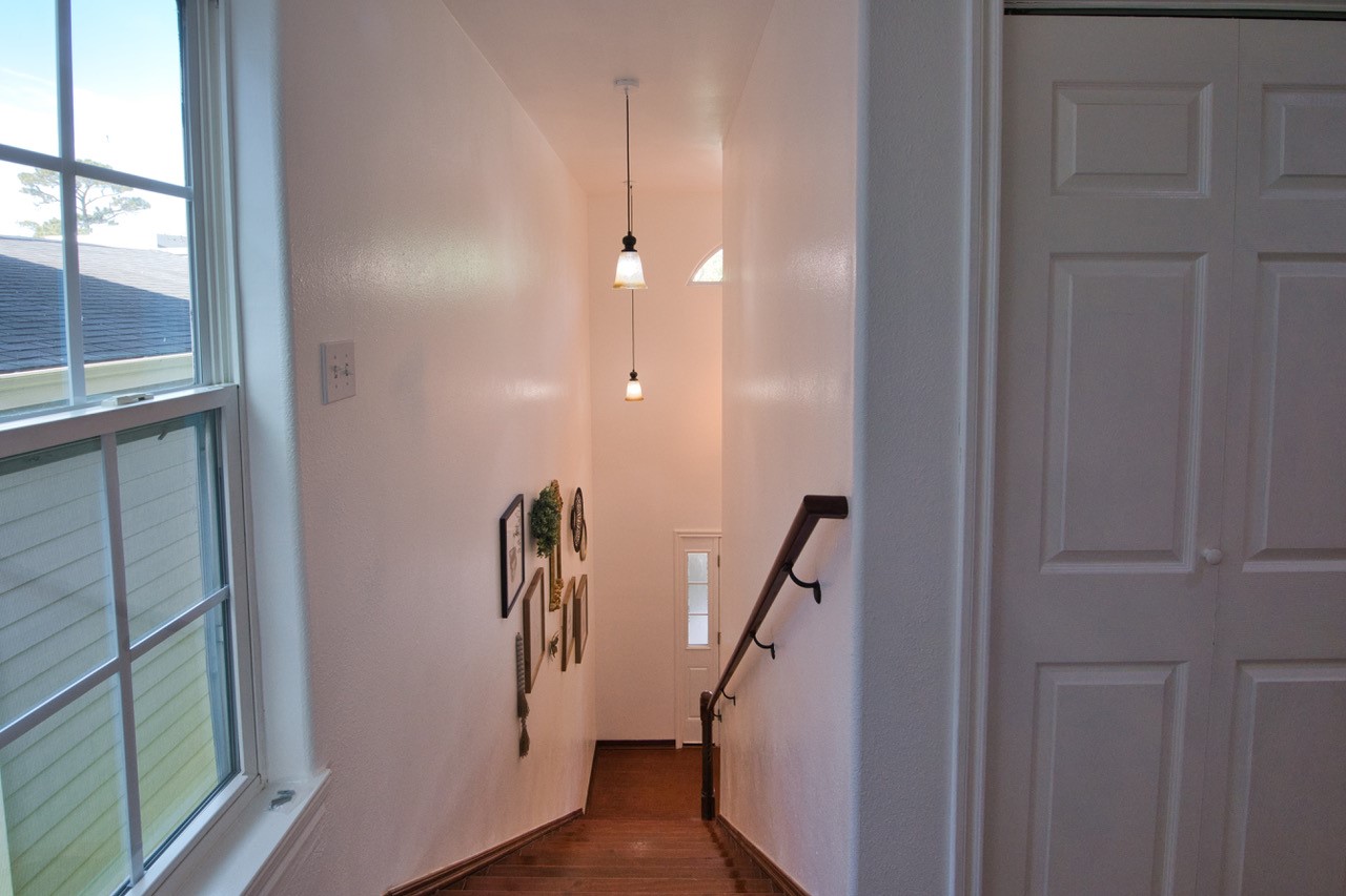 6703 Winton Street Houston, TX 77021 - Photo 26 of 49 stairwell leading upstairs